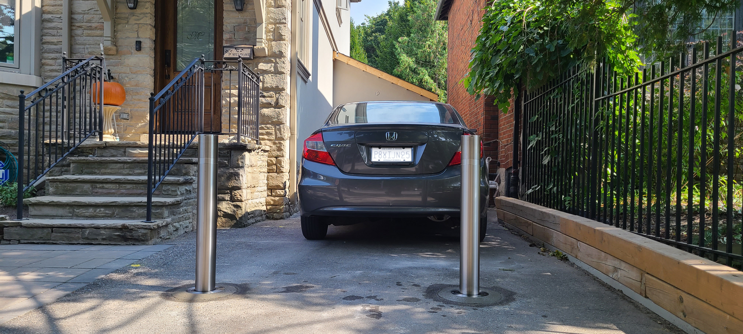 Driveway Bollards installed at residential home to prevent car theft